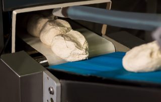 dough on the conveyor belt